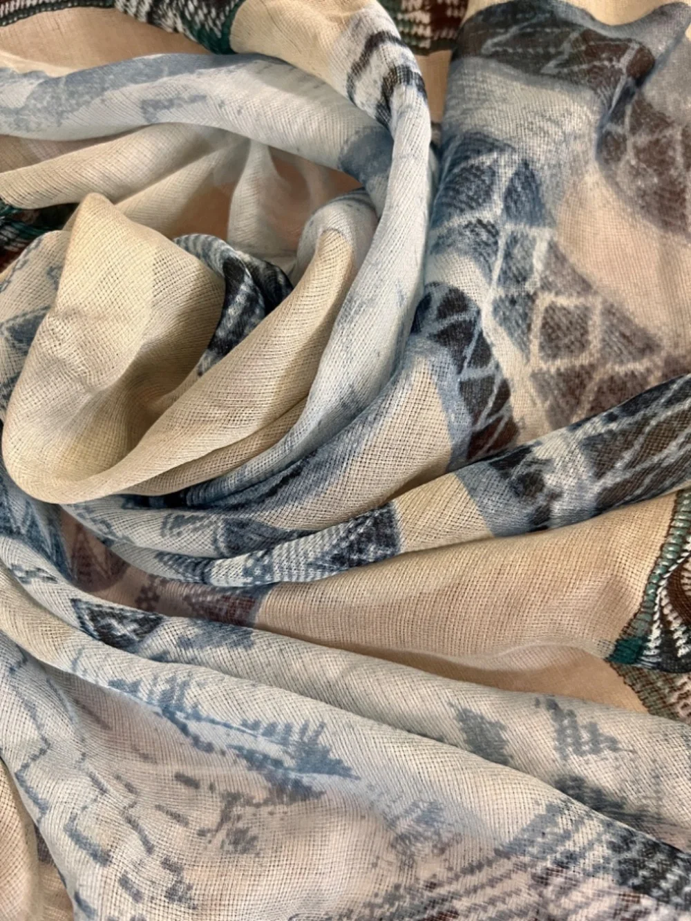 Square silk scarf with intricate graphic print of traditional woven baskets